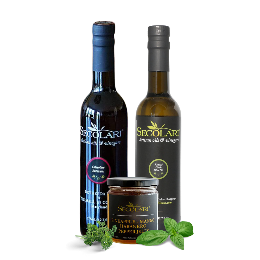 Two bottles of Secolari olive oil and vinegar with a jar of pineapple-mango habanero pepper jelly on a white background.